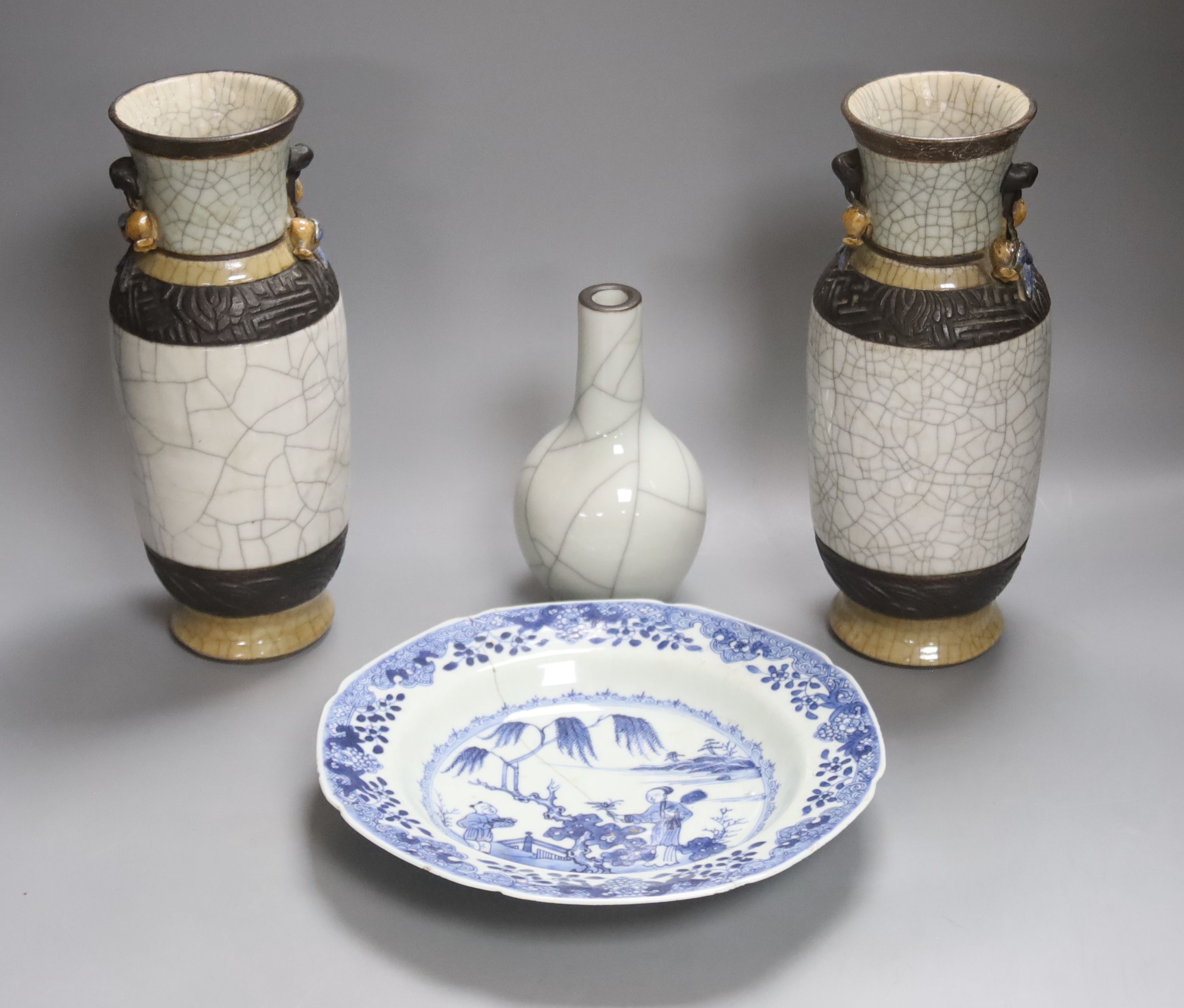 A late 19th century Chinese blue and white dish, together with a pair of crackle glaze vases and another, tallest 25cm